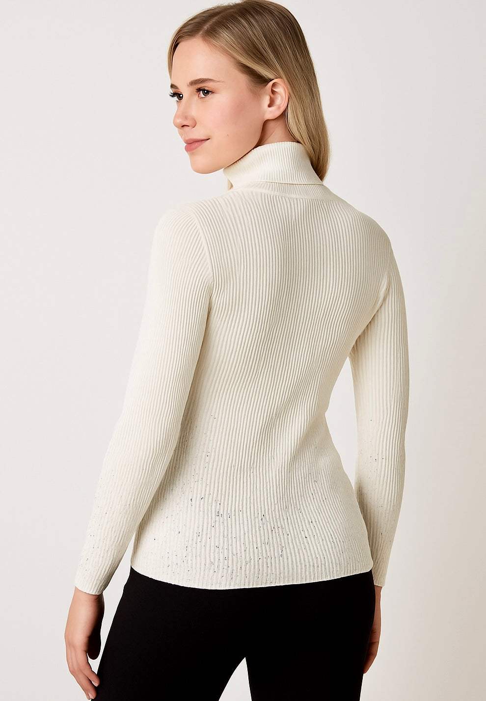 Carol Women’s Stud detailed cream roll neck jumper with stud embellishments on sleeves and lower back, model wearing UK size 8-14 knitwear