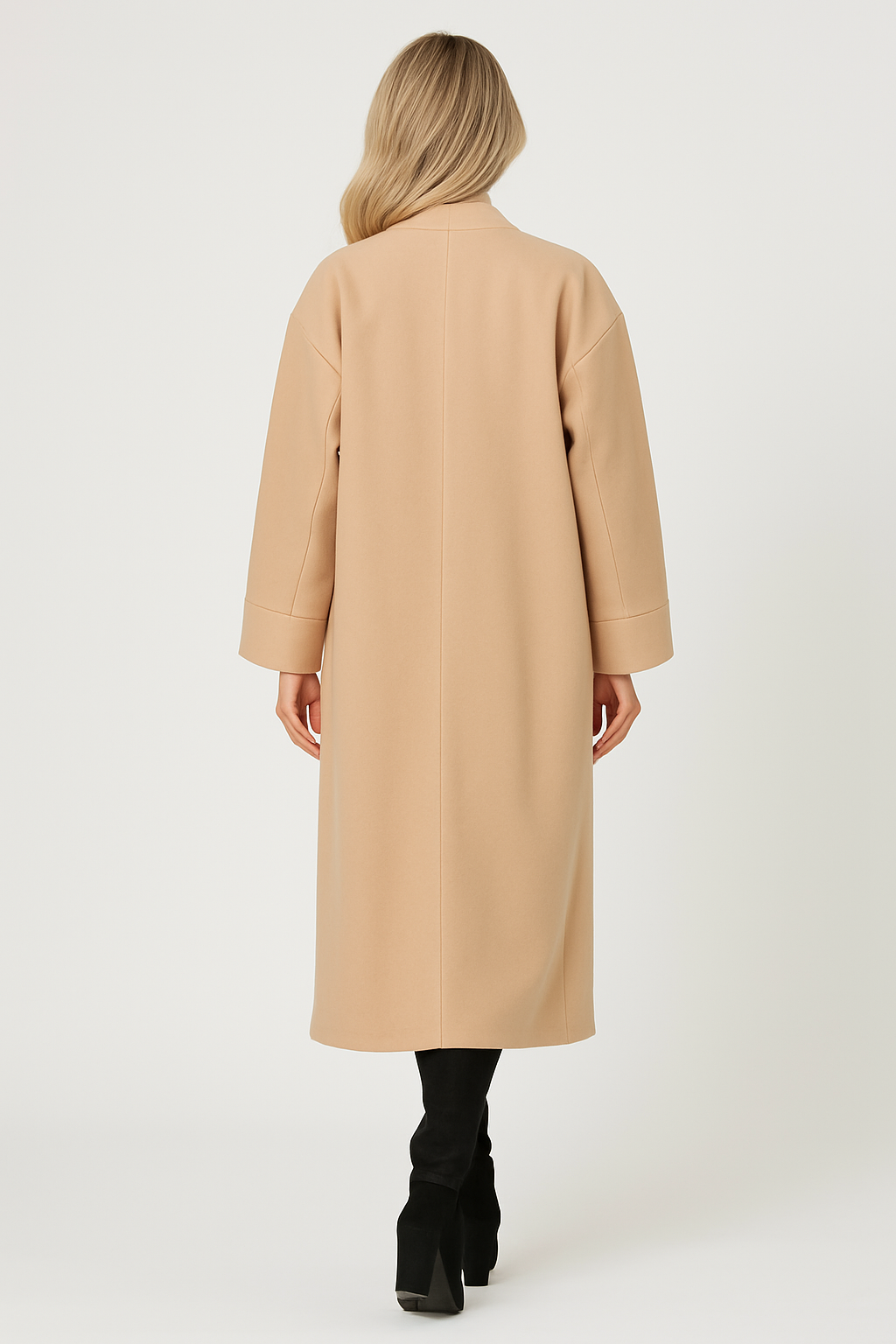 Back view of a woman wearing a beige Charlie Long Coat with a longline fit and black boots.