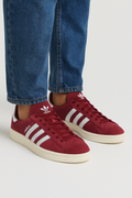 Adidas Campus 80s shoes in red nubuck with white 3-stripes and rubber outsole worn with jeans