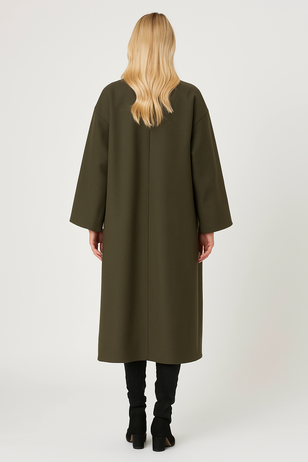 Back view of a woman wearing an olive green Charlie Long Coat with a longline design, paired with black boots.