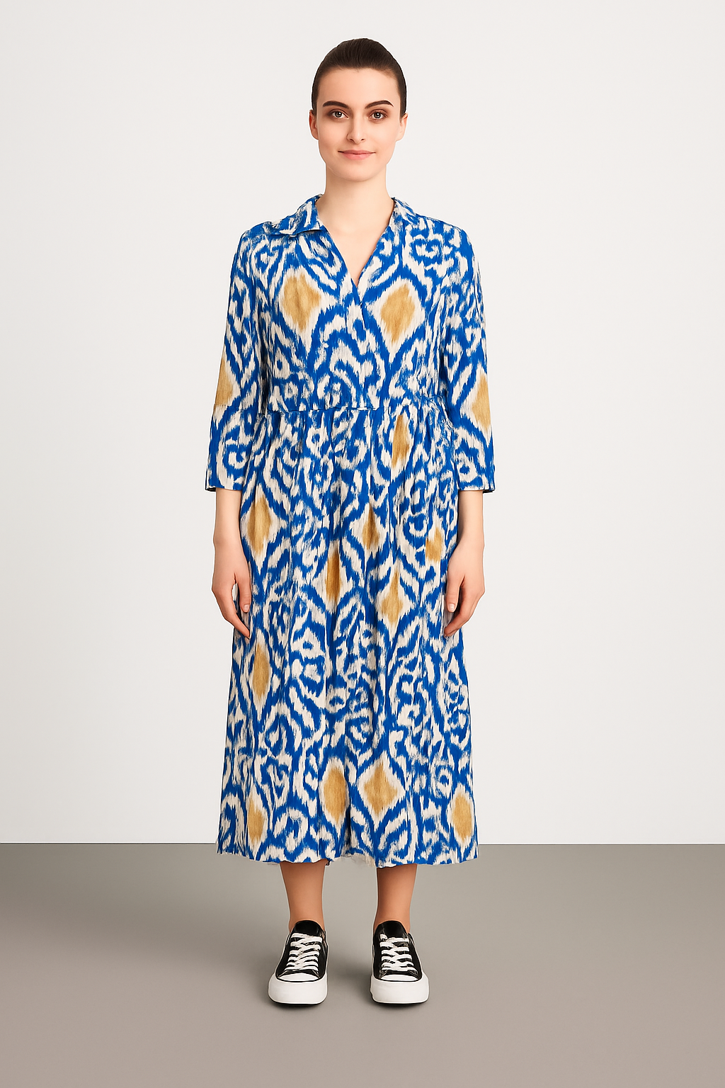 Italian Collar Button Maxi Dress in blue and beige patterned lightweight viscose with collared neckline and button-down front, worn with black sneakers.