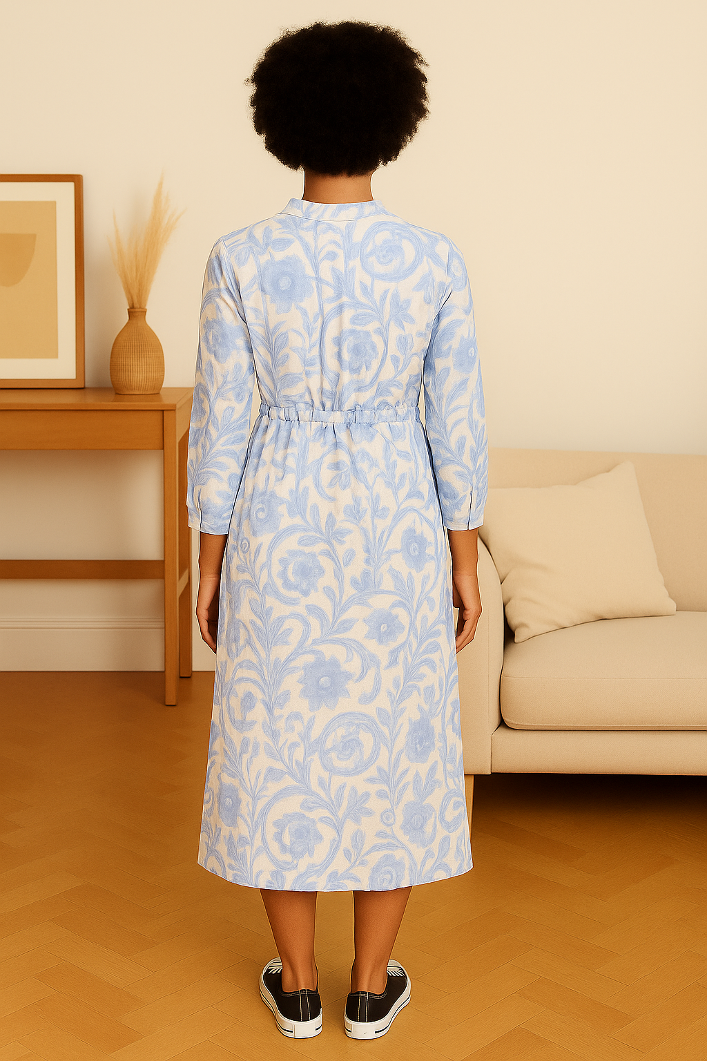 Back view of Italian Maxi Dress in blue floral pattern worn by model in casual indoor setting
