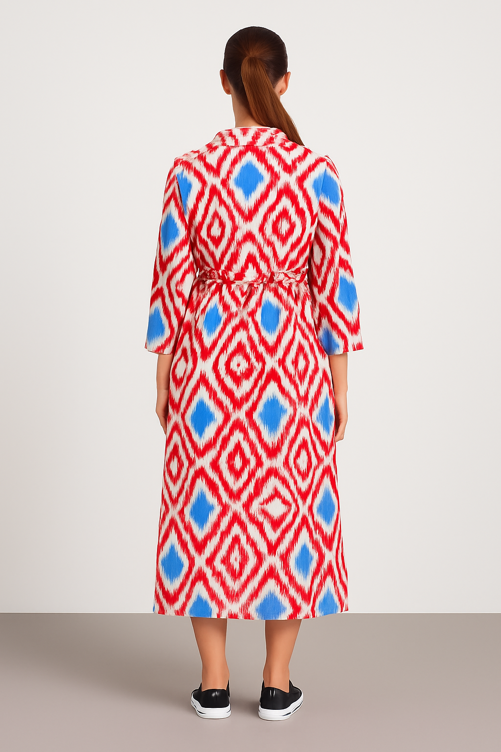 Back view of Italian Collar Button Maxi Dress in red and blue geometric pattern on lightweight viscose fabric, featuring three-quarter sleeves and a belted waist.