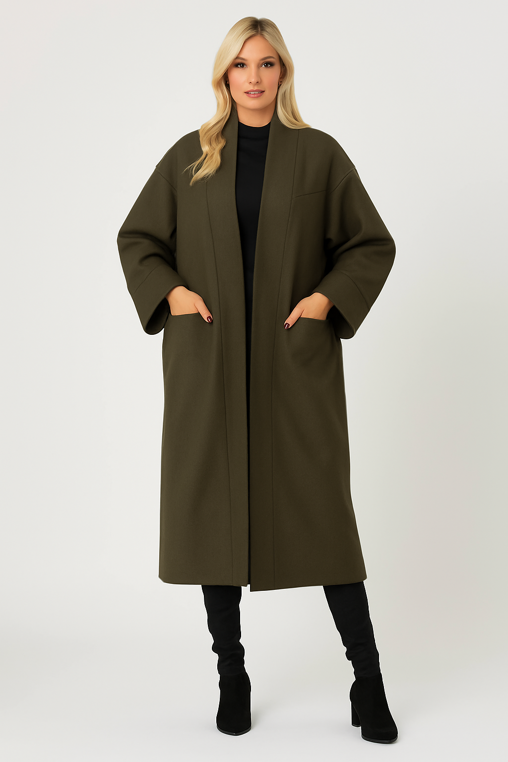 Woman wearing olive green Charlie Long Coat with deep side pockets and black outfit underneath, styled for casual and smart occasions