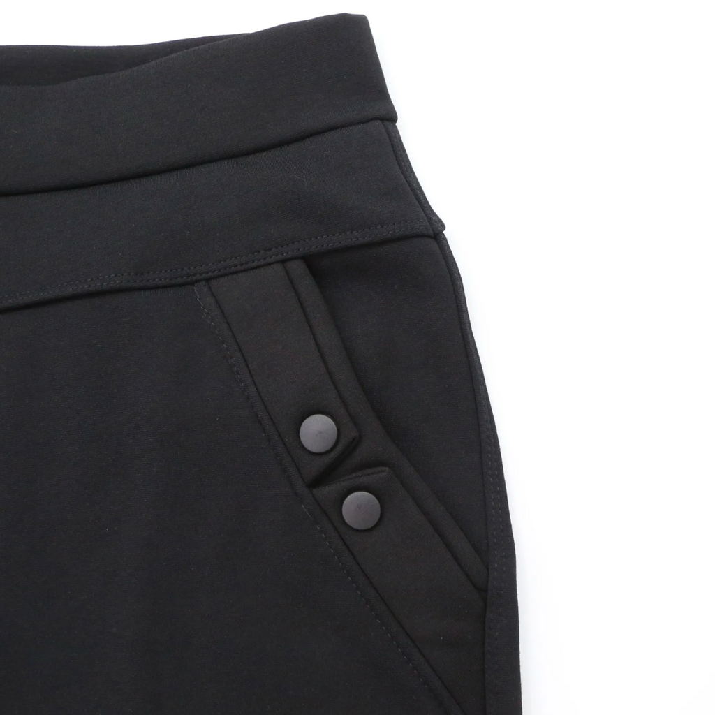Close-up of black Flo Fleece Lined Leggings waistband and side pocket with button details showing soft, stretchy fabric and high-waisted design
