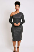 Model wearing a shimmering black one-shoulder cold shoulder midi dress with long sleeves and a bodycon fit, styled with black ankle-strap heels