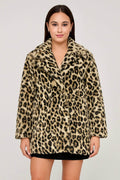 Woman wearing a stylish faux fur leopard print jacket with side pockets and a soft plush texture