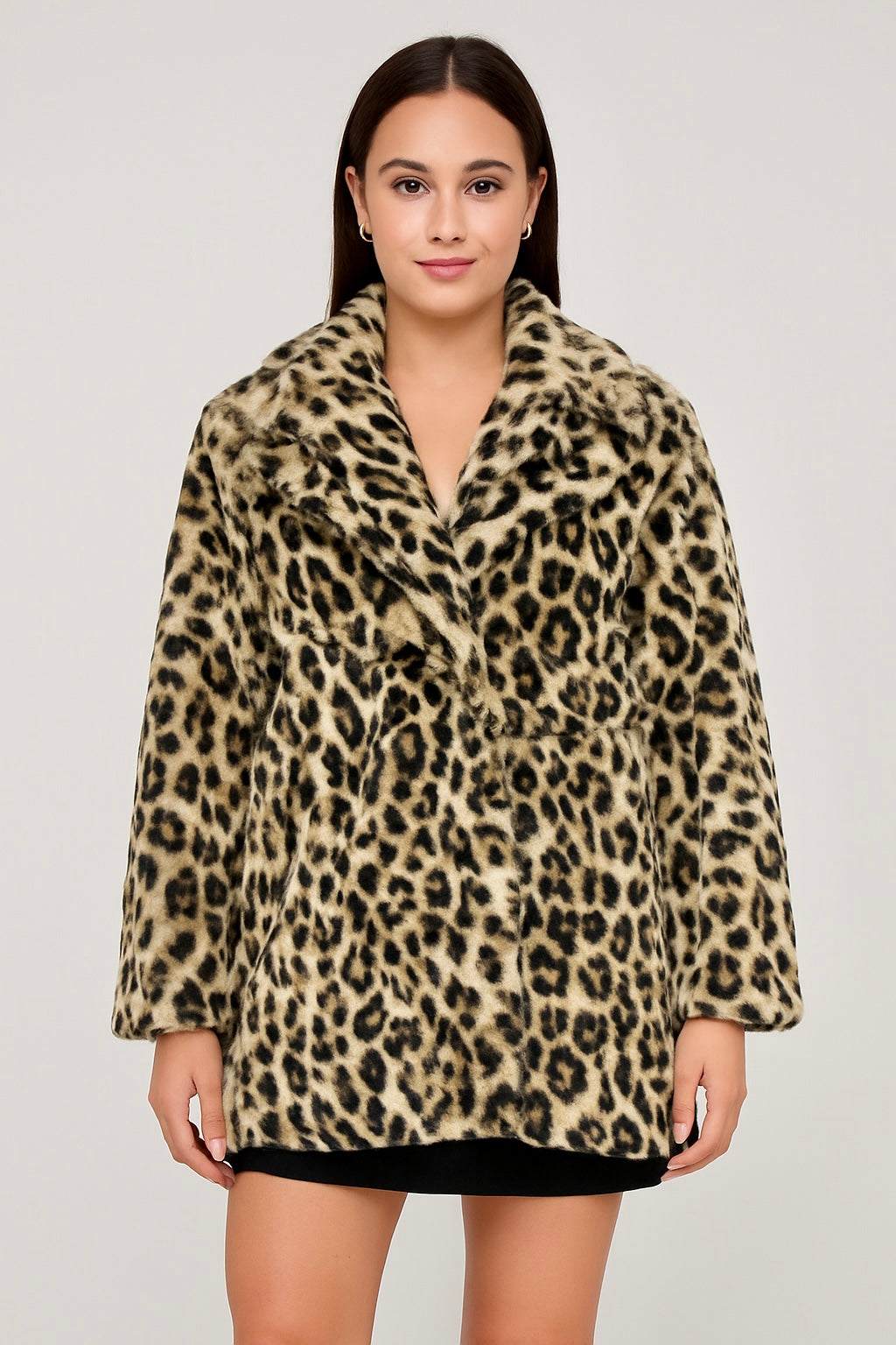 Woman wearing a stylish faux fur leopard print jacket with side pockets and a soft plush texture