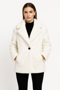 Woman wearing white Hazel Extra Thick Faux Fur coat with soft, thick texture and relaxed fit