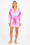 Woman wearing a lightweight pink and purple tie dye dressing gown with a wrap front and adjustable tie belt