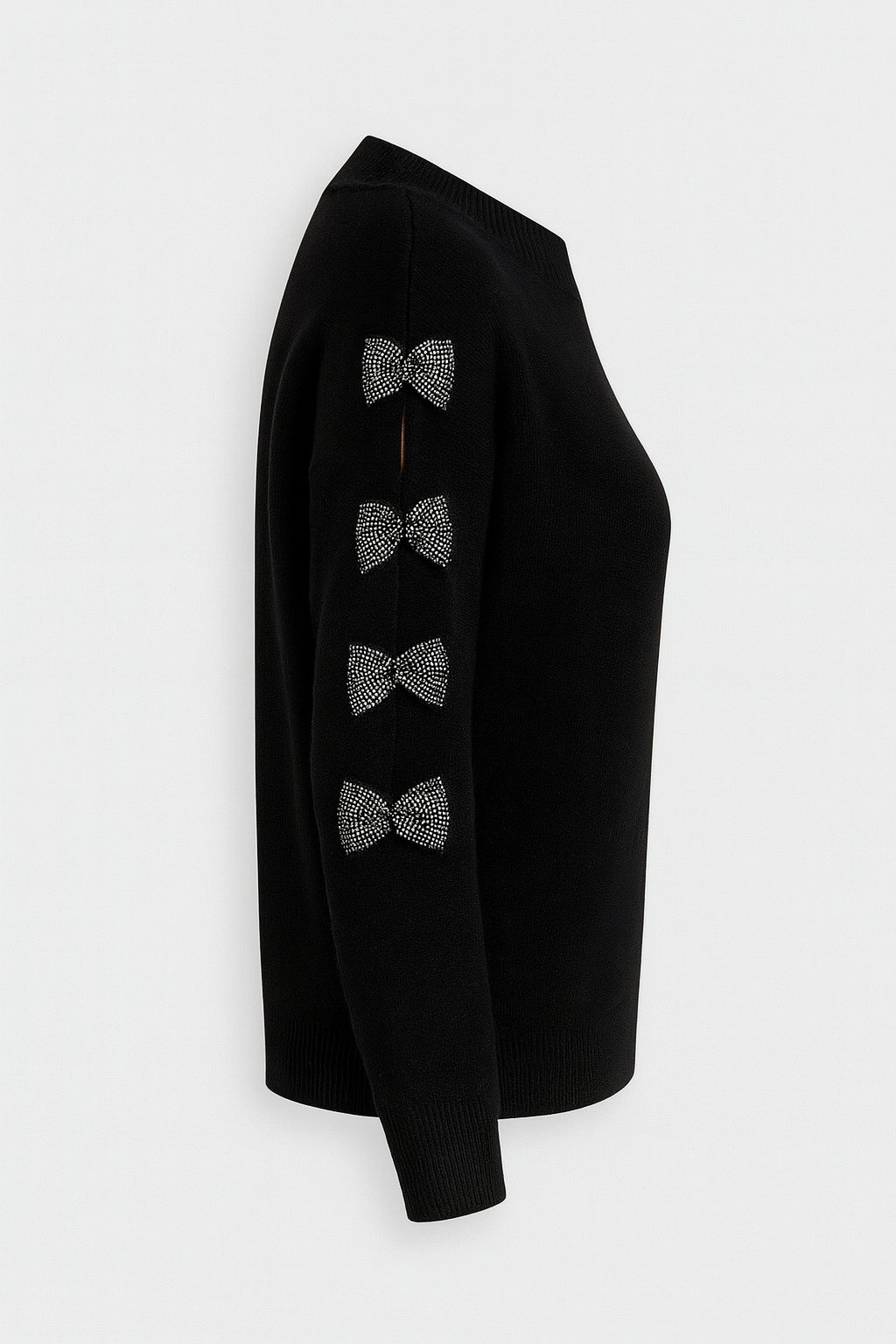 Black knit jumper with diamanté bow details along the sleeve, soft and stretchy fabric blend, feminine and stylish design.