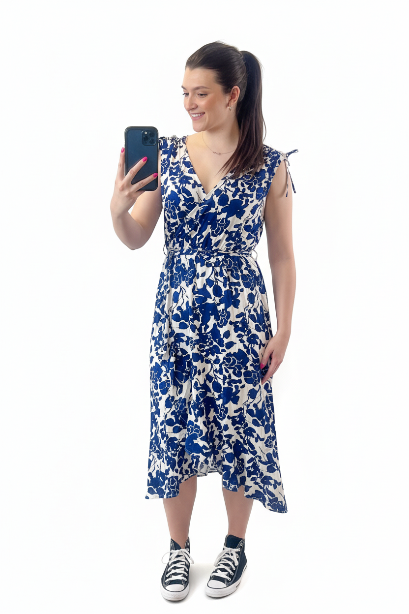 Model in Blue Floral Dress on White Background