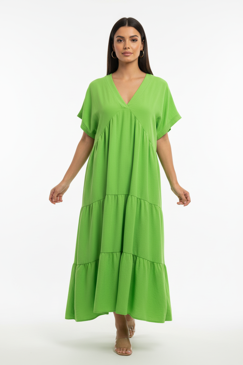 Model wearing green dress on white background